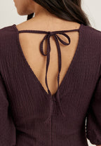 Violetti trikoinen midimekko