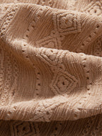Pikeepaidan geometrisen jacquard-kuvion yksityiskohta