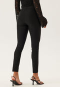 Mustat, nilkkapituiset skinny-housut
