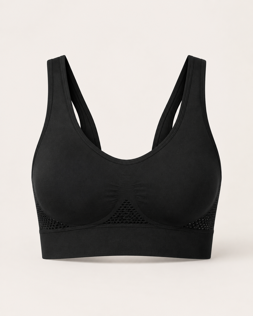 Breathable seamless sports bra in black, product-only studio view
