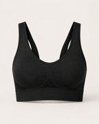 Breathable seamless sports bra in black, product-only studio view