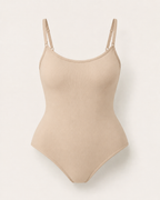 Seamless shaping bodysuit in beige, product-only studio view